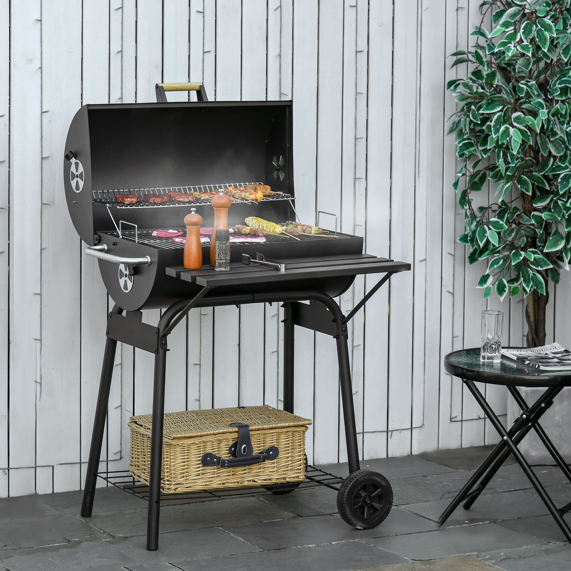 Adjustable outlet charcoal grill