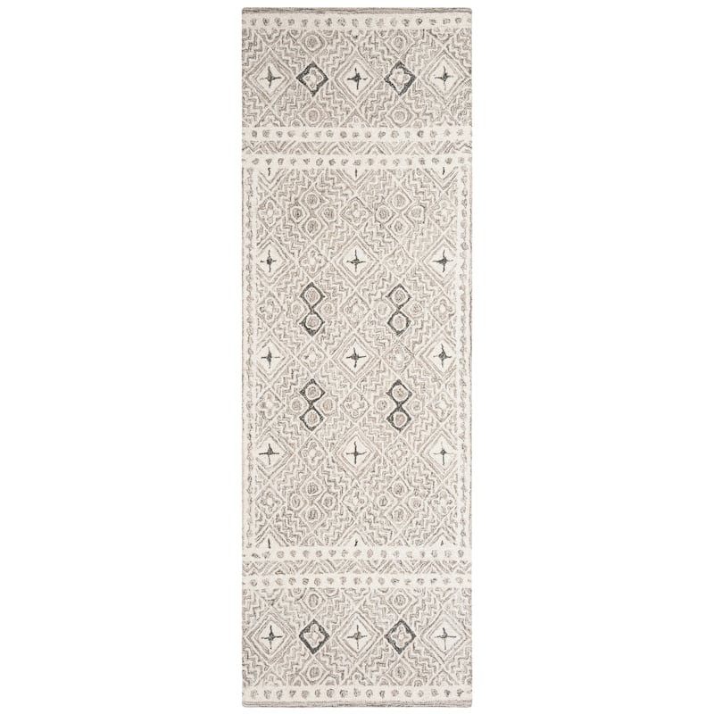 SAFAVIEH Handmade Micro-Loop Jelske Wool Rug