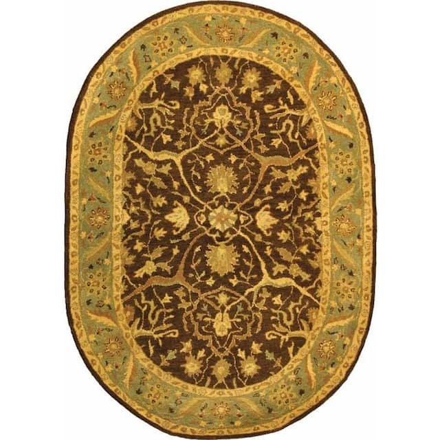 SAFAVIEH Handmade Antiquity Izora Traditional Oriental Wool Rug - 4'6" x 6'6" Oval - Brown/Green