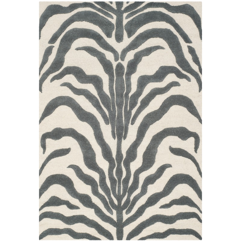 SAFAVIEH Handmade Cambridge Rikey Animal Print Wool Rug - 5' x 8' - Ivory/Dark Grey