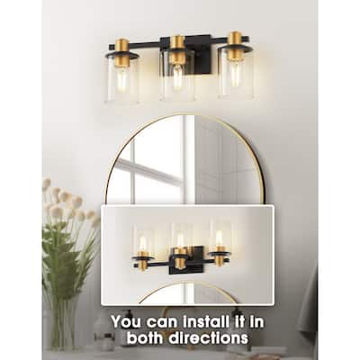 YANSUN 3-Light Mirror Vanity Light, Black and Gold, E26 Sockets, Clear Cylindrical Glass Shades, Square Base and Rod Design