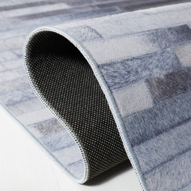 SAFAVIEH Faux Hide Machine Washable Slip Resistant Virzhinia Modern