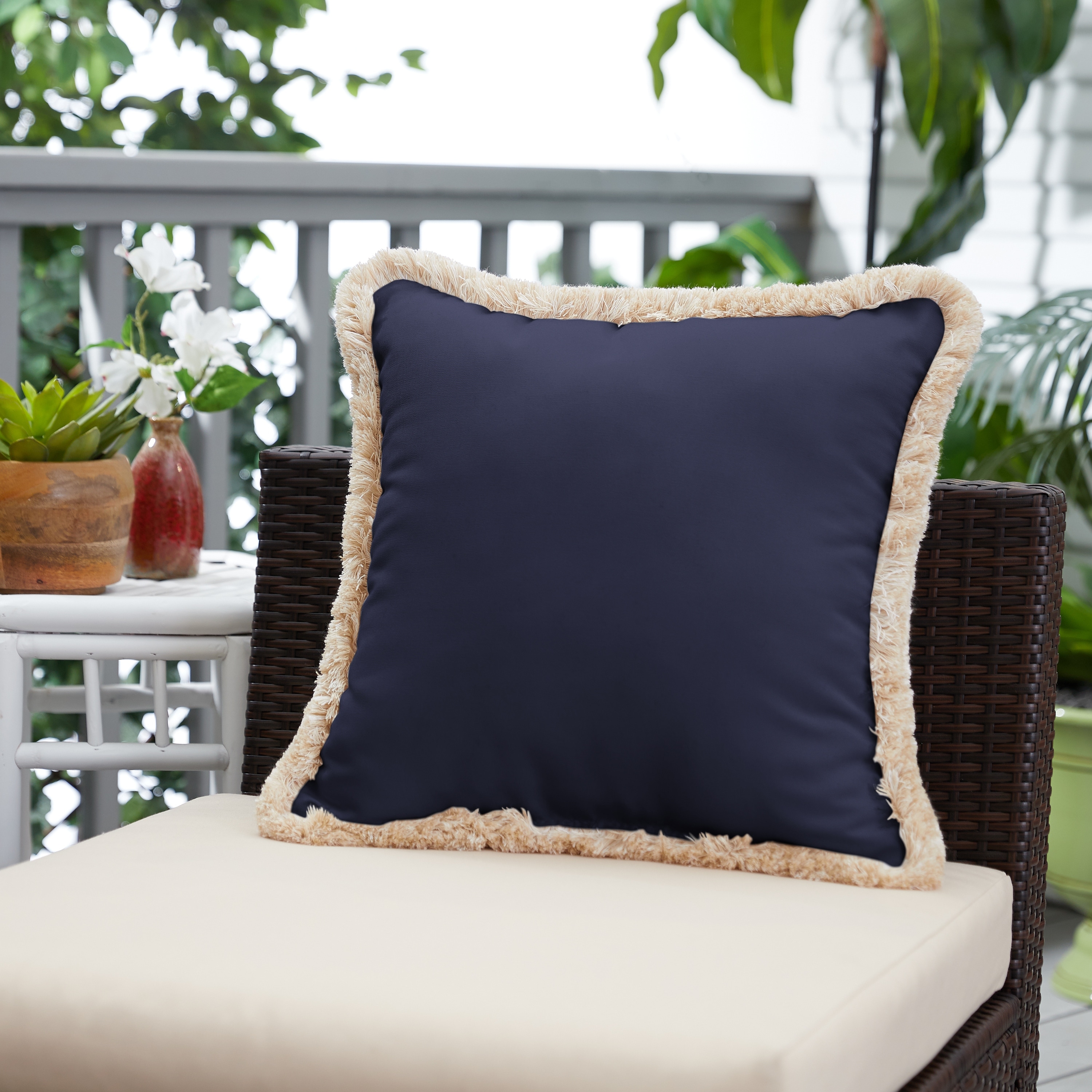 https://ak1.ostkcdn.com/images/products/is/images/direct/1c711f8a66549bec850cf48e88bc04cb8d8b1ca1/Sunbrella-Canvas-Navy-Indoor--Outdoor-Square-Pillow-with-Fringe.jpg