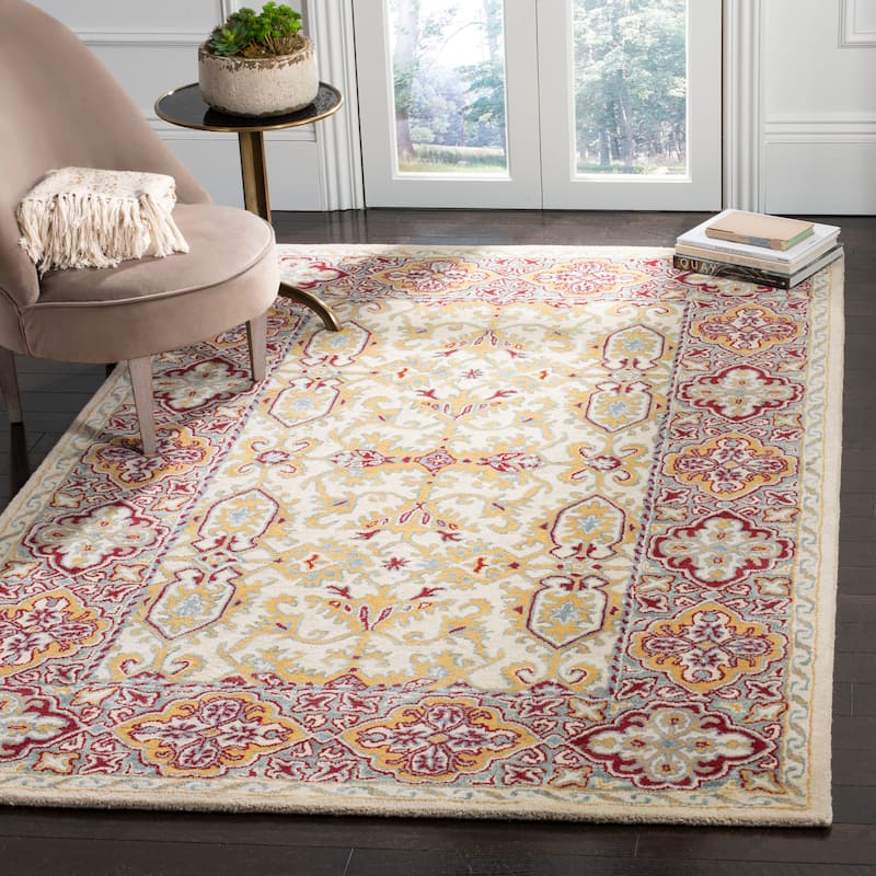 SAFAVIEH Handmade Heritage Wildfire Traditional Oriental Wool Rug - 6' x 9' - Ivory/Blue