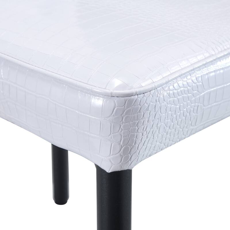 A set of 4 white and black vintage crocodile leather cushioned dining chairs, featuring crystal clasp design and leather