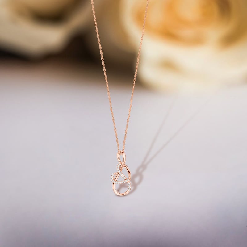 1/10ct TDW Diamond Infinity Heart Pendant Necklace in 10K Gold for Women