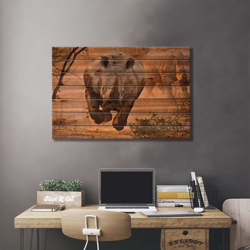 Rhino Learning To Fly Print On Wood by Justus Vermaak - Multi-Color