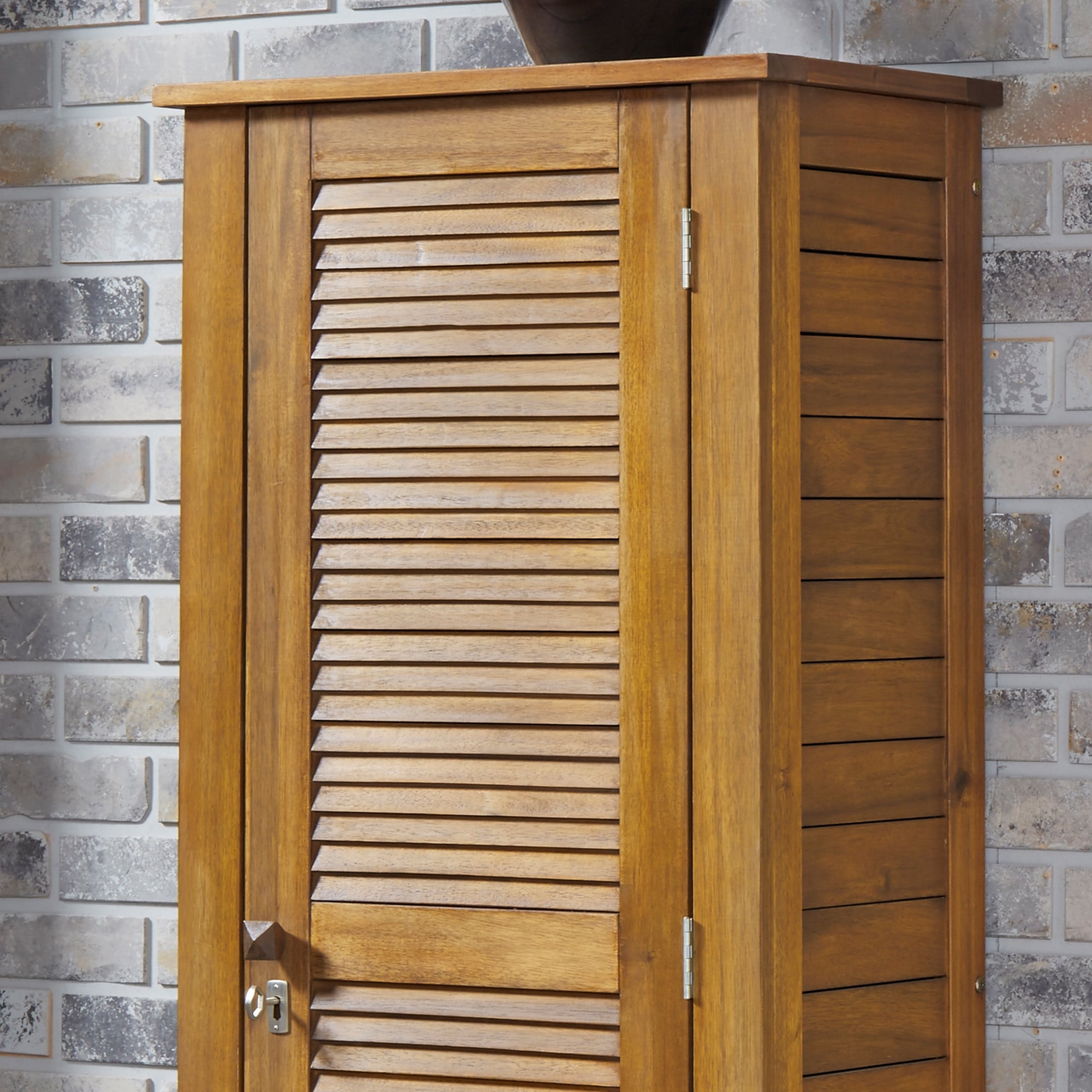 https://ak1.ostkcdn.com/images/products/is/images/direct/1d1cedabf0b0802f8879d6be38ef9c3dfb121b40/Maho-Outdoor-Golden-Teak-Single-Door-Storage-Cabinet.jpg