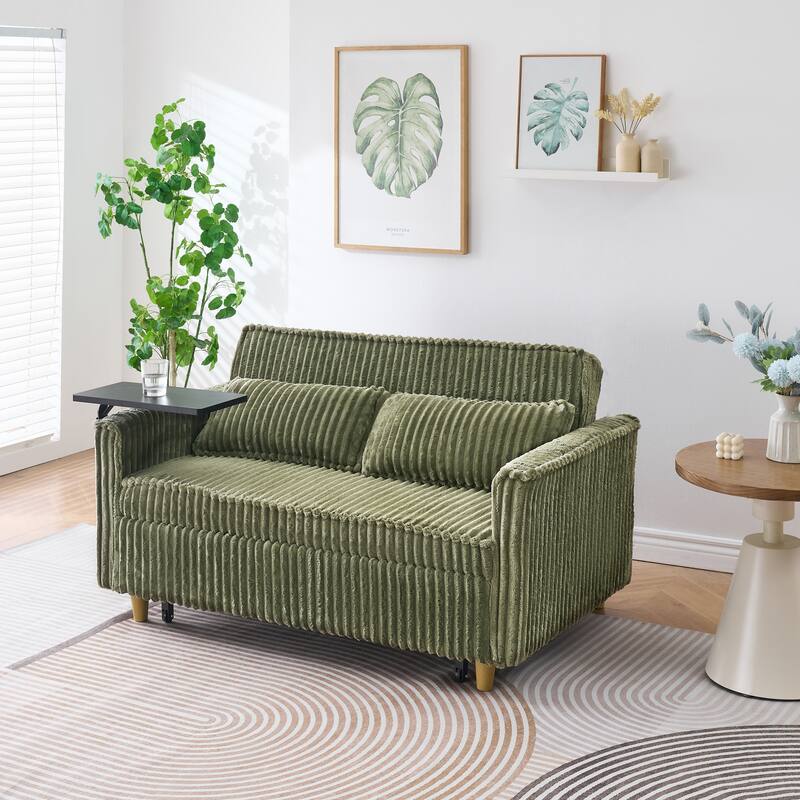 The pull-out and push-in green corduroy sofa with dual functions, equipped with a movable tabletop and USB ports