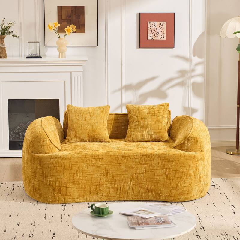 Curved 2 person compress sofa. It has armrests on both sides, comes with two pillows,is suitable for small - sized apartments