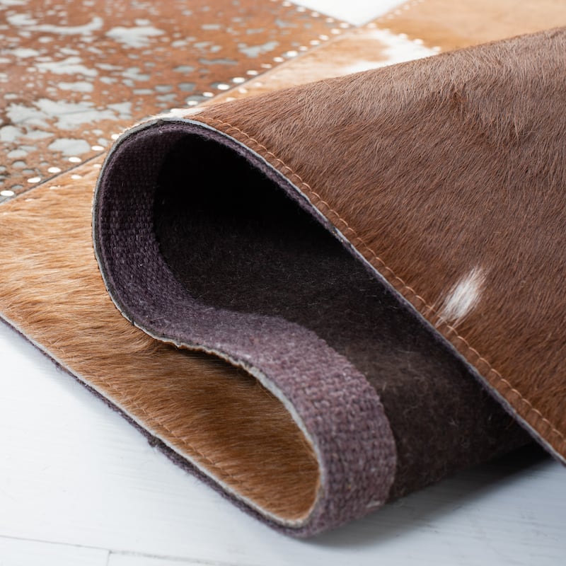 SAFAVIEH Handmade Studio Leather Irmgarda Modern Rug