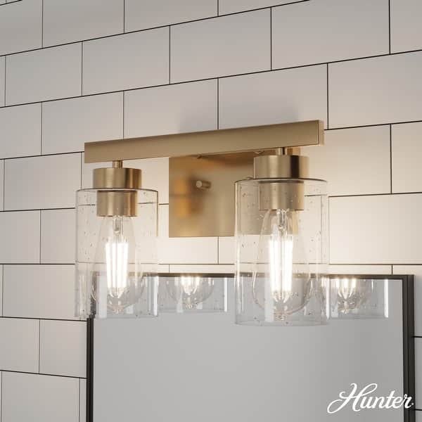 slide 2 of 9, Hunter Hartland Bathroom Vanity Wall Light, Damp Rated - Transitional, Rustic, Contemporary - Clear Seeded Glass 2-Light - Alturas Gold