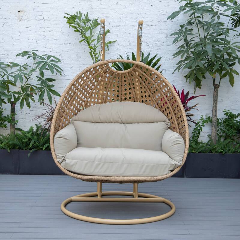 LeisureMod Mendoza 2-Person Hanging Egg Swing Chair - Handcrafted Light Brown Wicker, Patio Hammock Lounger with Cushions - 53"