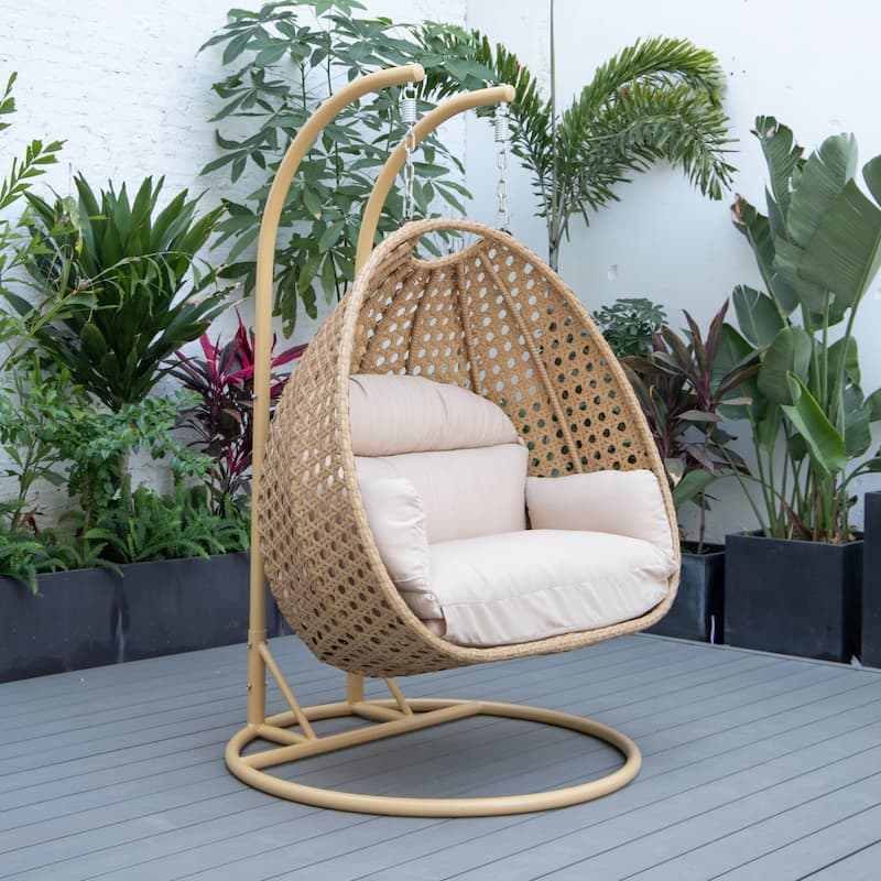 LeisureMod Mendoza 2-Person Hanging Egg Swing Chair - Handcrafted Light Brown Wicker, Patio Hammock Lounger with Cushions - 53"