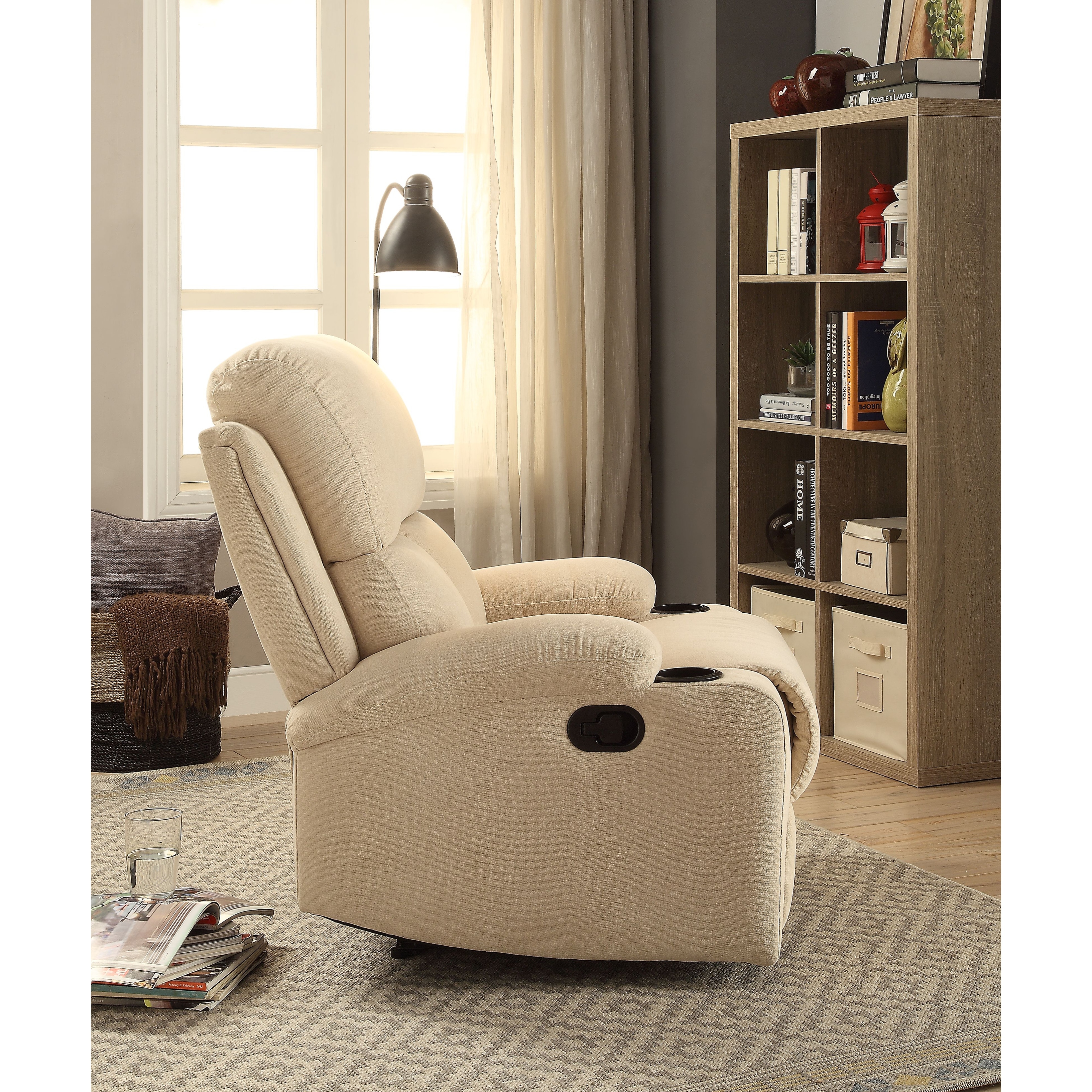 https://ak1.ostkcdn.com/images/products/is/images/direct/1e2123adf39661cb70029cb80d63ed05d4a63c30/Beige-Vintage-Motion-Recliner-with-Tight-Back-%26-Seat-Cushions-and-Pillow-Top-Arm-%26-Cup-Holder.jpg