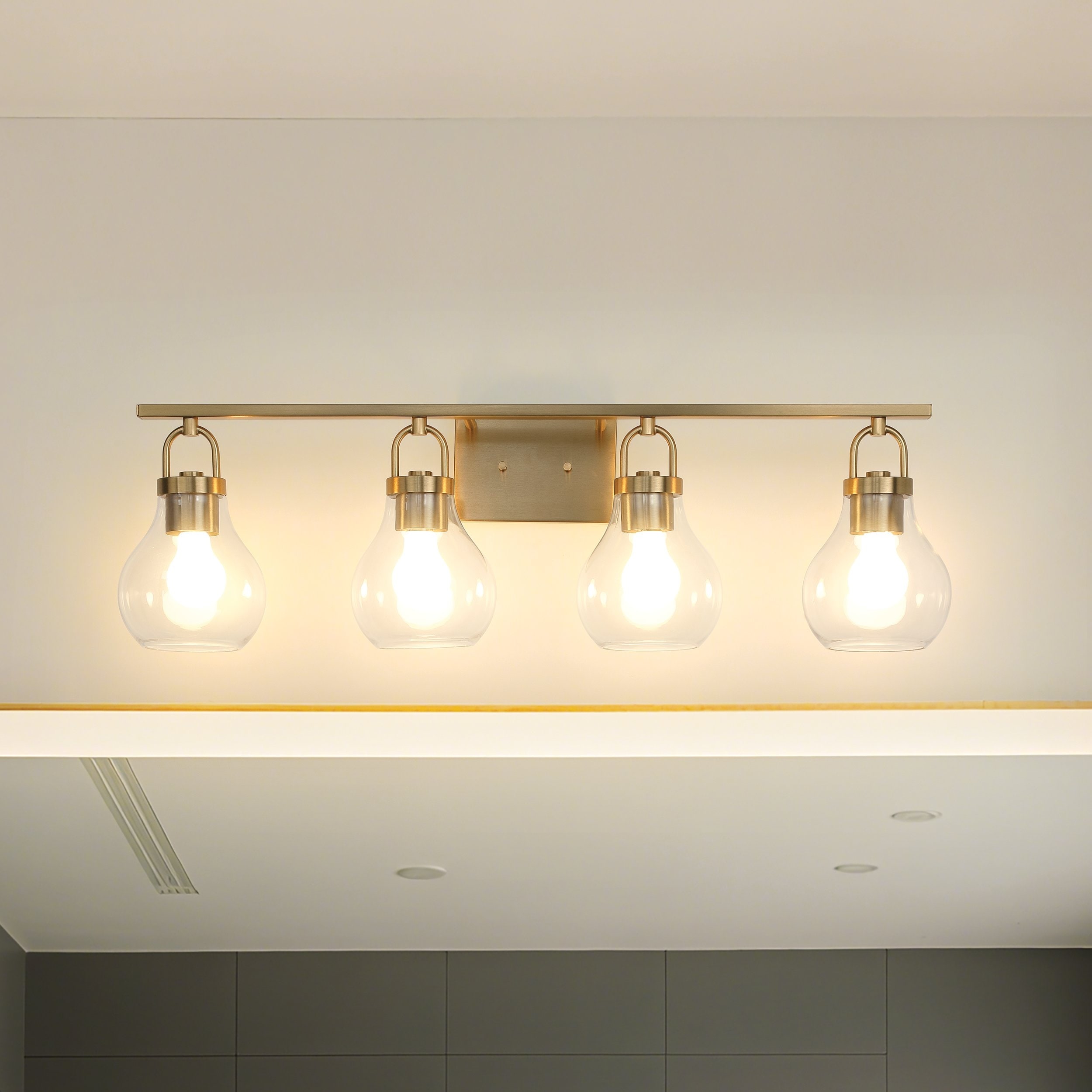Thesis Mansfield 34-inch 4-light Champagne Gold Vanity Light with Clear Glass Shades