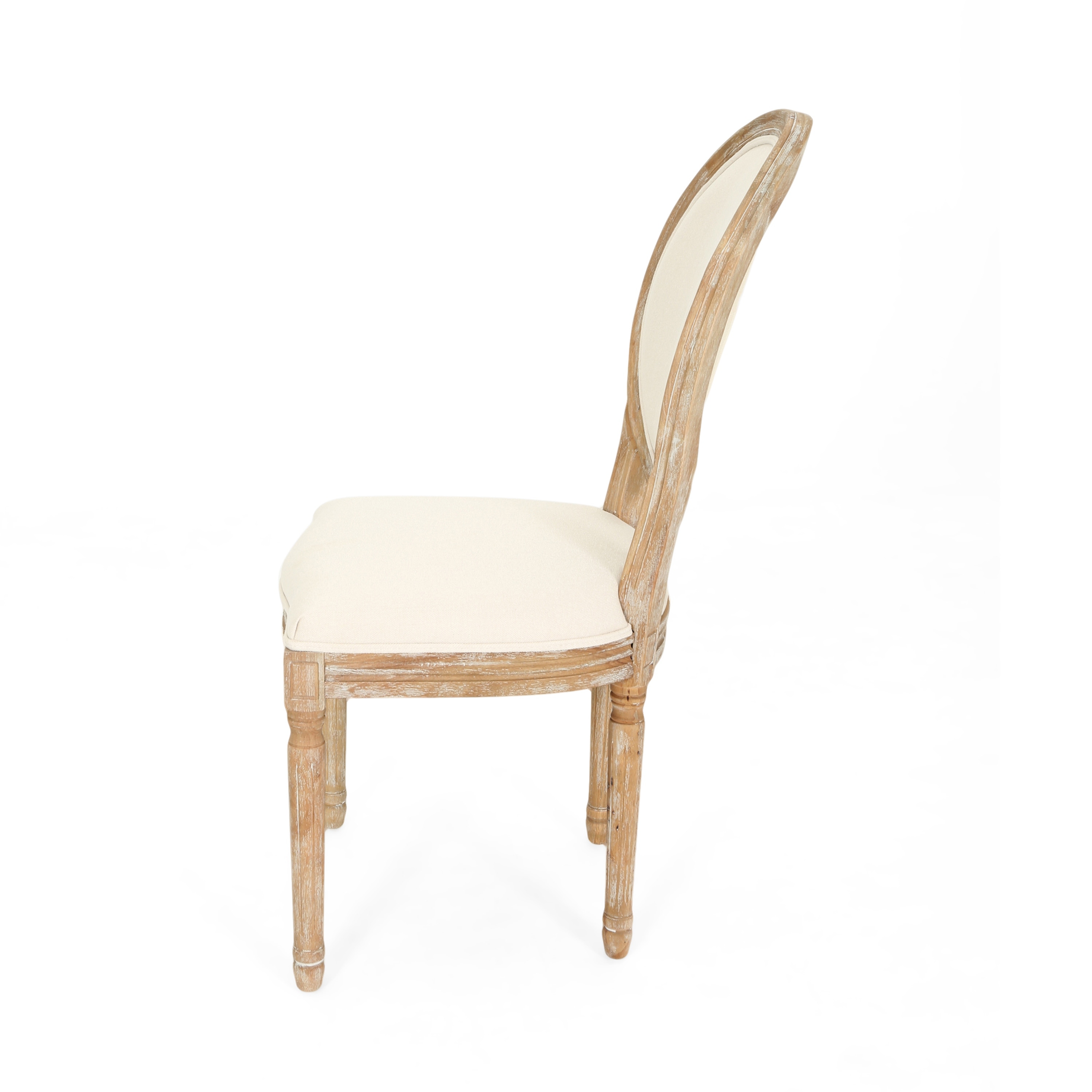 Upholstered farmhouse dining chair with a cream-colored seat and patterned backrest.