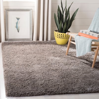 SAFAVIEH Handmade South Beach Leonella Shag Solid Polyester Rug