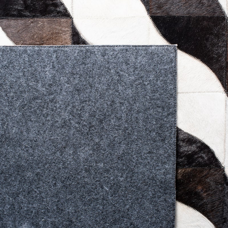 SAFAVIEH Handmade Studio Leather Danyel Modern Rug