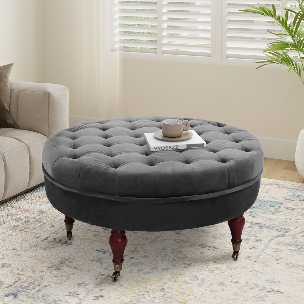 https://ak1.ostkcdn.com/images/products/is/images/direct/1fe02548693c618f4114b5d8ba6da94f949a869b/Maypex-32-inch-Tufted-Velvet-Round-Cocktail-Ottoman-with-Wheels.jpg