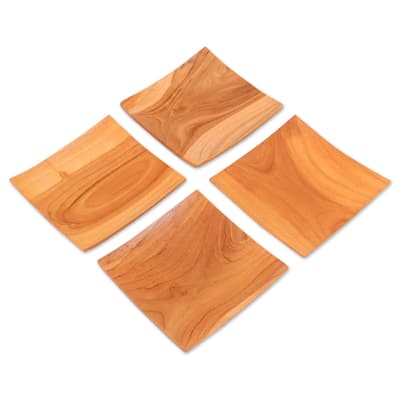 NOVICA Teakwood plates, 'Fine Meal' (set of 4)