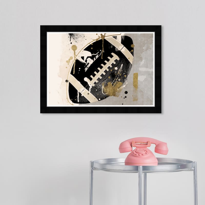 Wynwood Studio Canvas Sports and Teams Tan and Gold Football Black and Modern & Contemporary Wall Art Canvas Print - Black