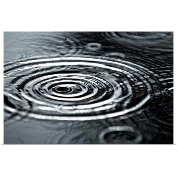 "Raindrops fall into a puddle during an afternoon rainstorm in Truckee, California." Poster Print