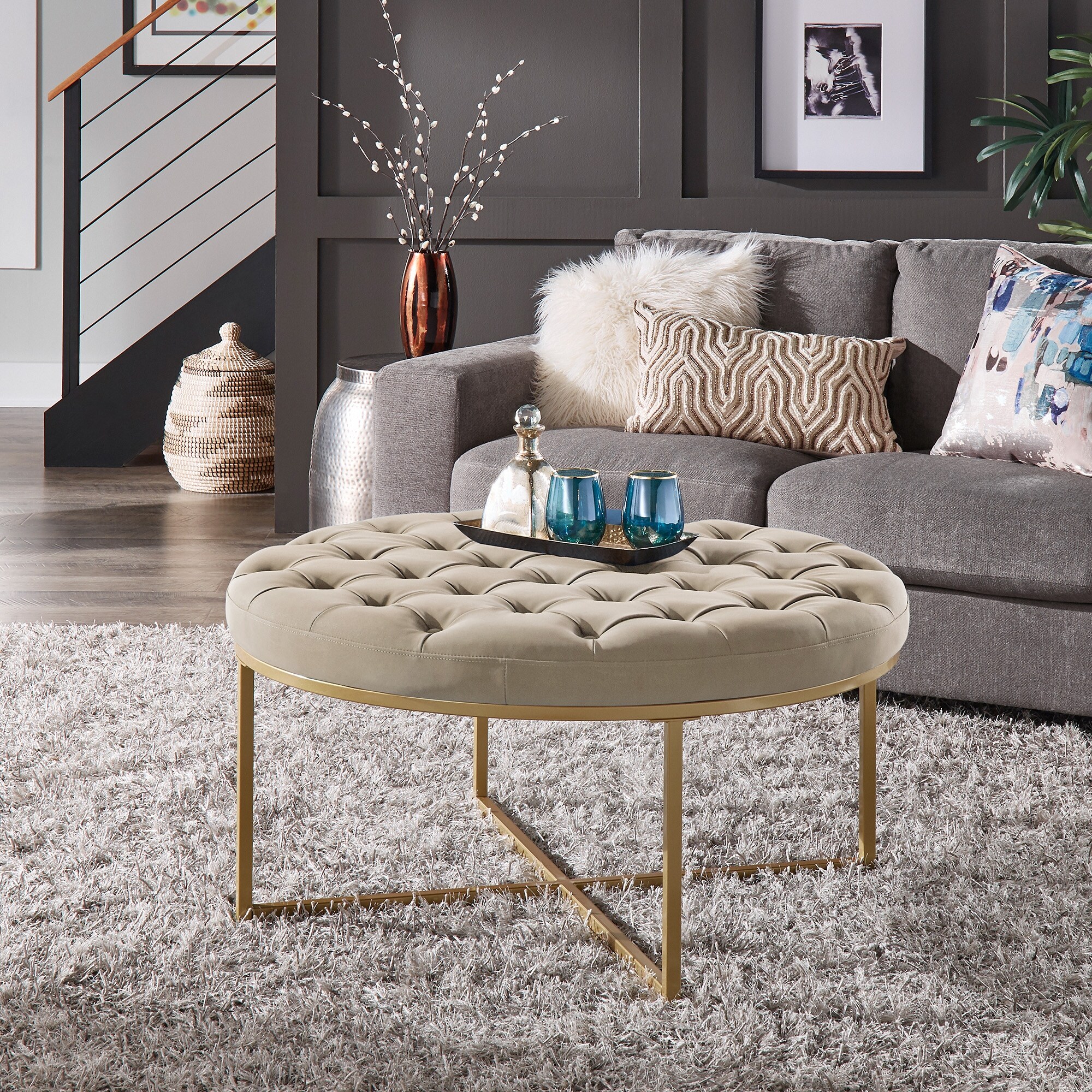 https://ak1.ostkcdn.com/images/products/is/images/direct/2149be3194782ef13f9272cc69ed90732d120ea0/Devin-Polished-Faux-Leather-Round-Tufted-Cocktail-Ottoman-by-iNSPIRE-Q-Modern.jpg