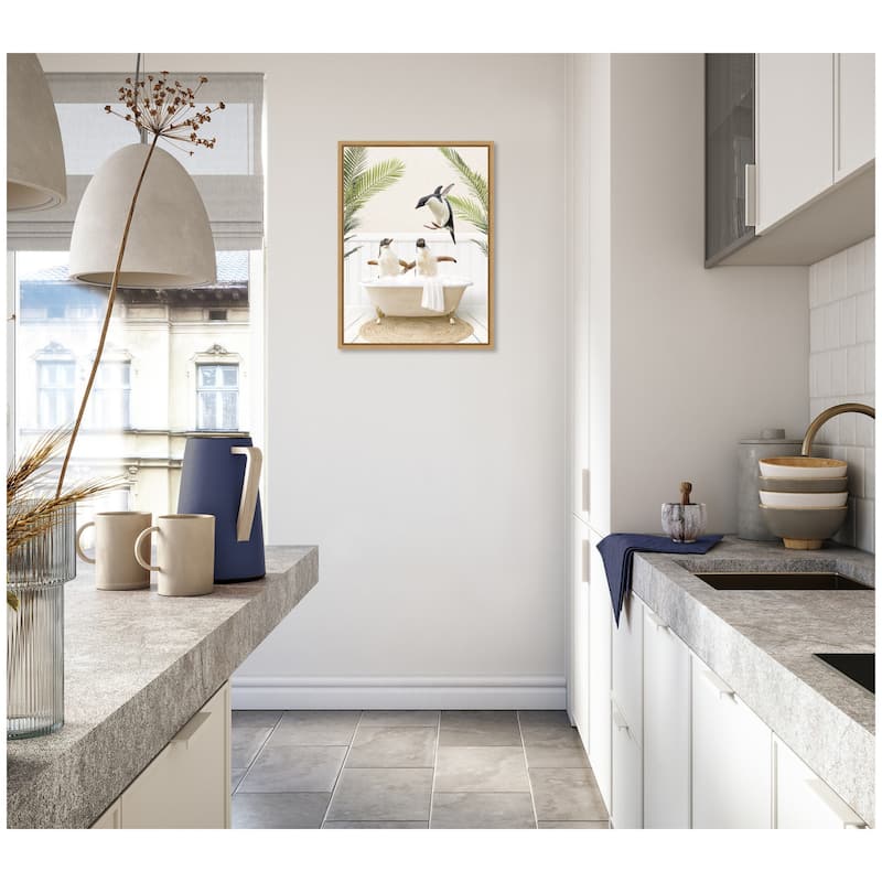 Kate and Laurel Sylvie Penguins in Palm Bathtub Framed Canvas by Amy Peterson