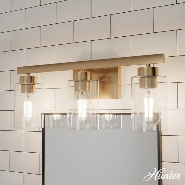 slide 2 of 6, Hunter Hartland Bathroom Vanity Wall Light, Damp Rated - Transitional, Rustic, Contemporary - Clear Seeded Glass 3-Light - Alturas Gold