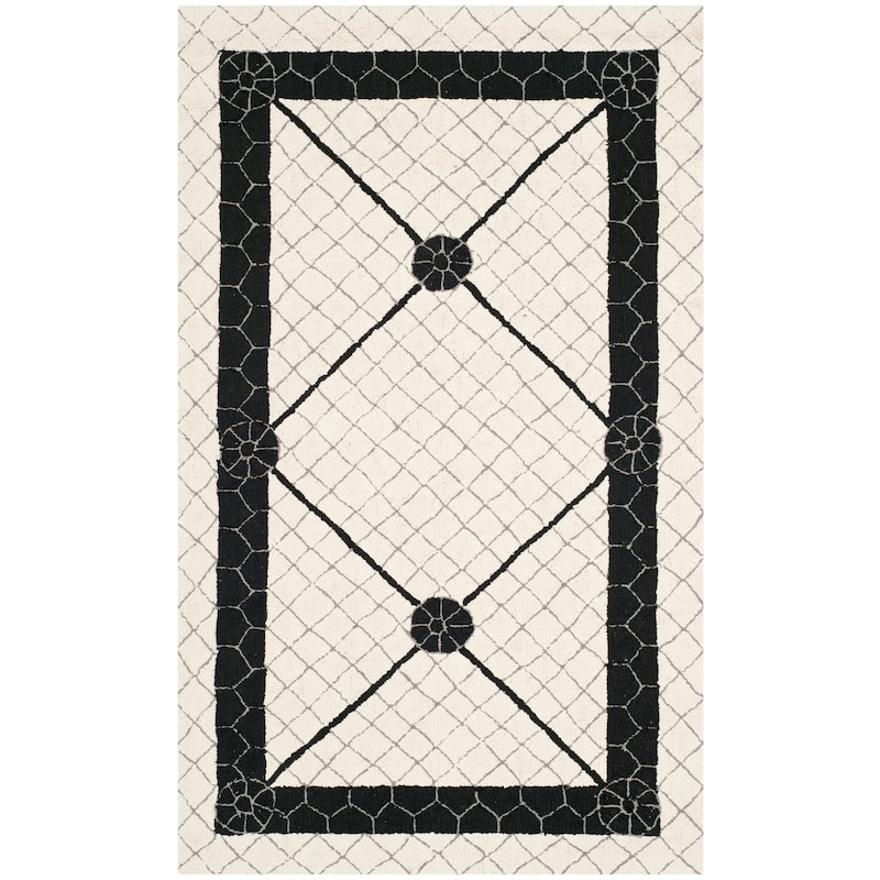 SAFAVIEH Handmade Newport Kaliyah Modern Cotton Rug - 3'9" x 5'9" - Ivory/Black
