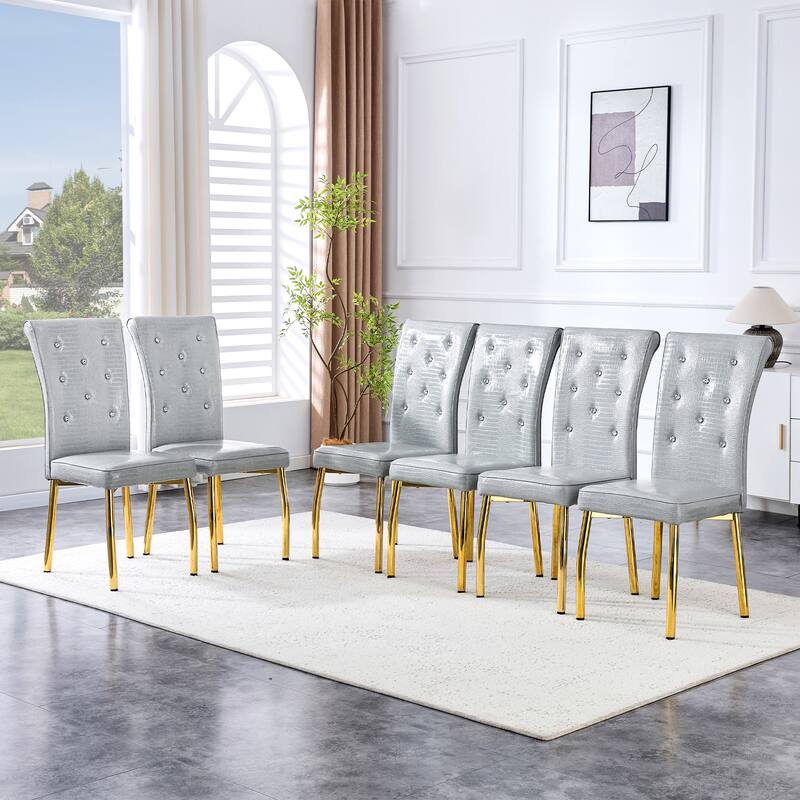 A set of 4 white and black vintage crocodile leather cushioned dining chairs, featuring crystal clasp design and leather