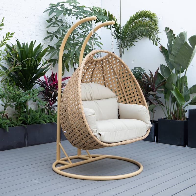 LeisureMod Mendoza 2-Person Hanging Egg Swing Chair - Handcrafted Light Brown Wicker, Patio Hammock Lounger with Cushions - 53"