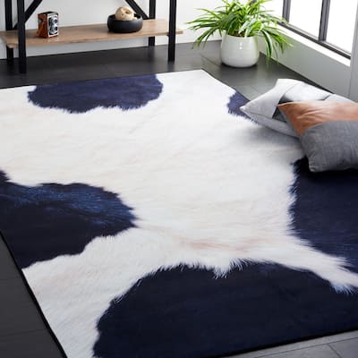 SAFAVIEH Faux Hide Machine Washable Slip Resistant Daphna Rustic Cow Print Rug