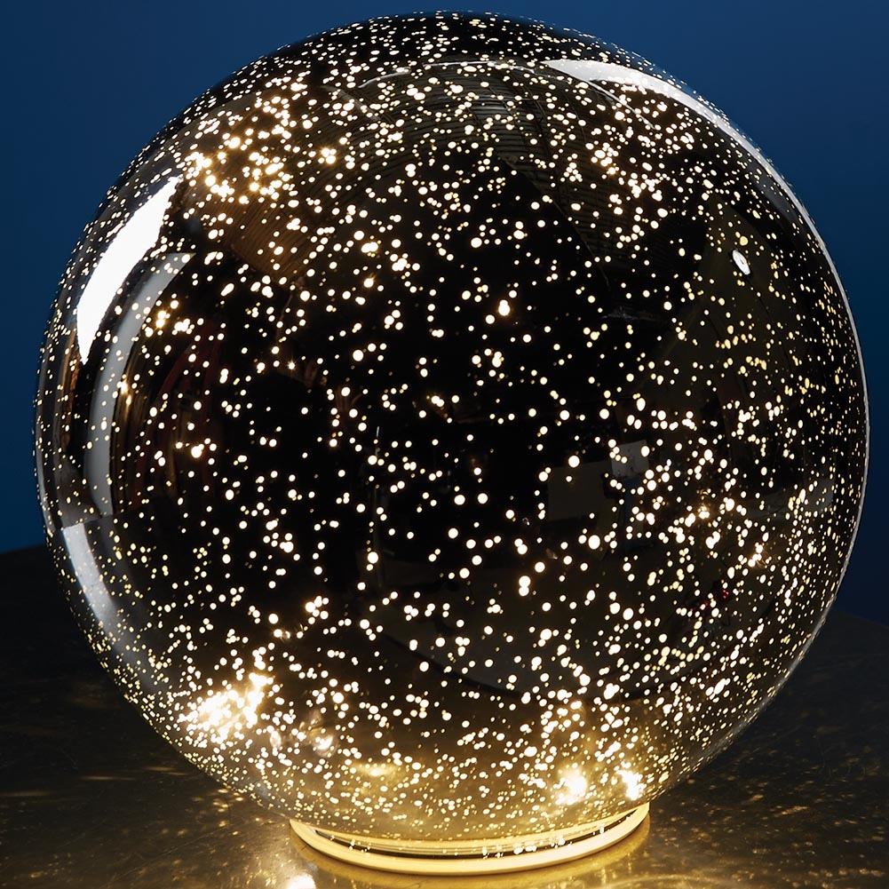 Image of Large clear gazing ball reflecting sky