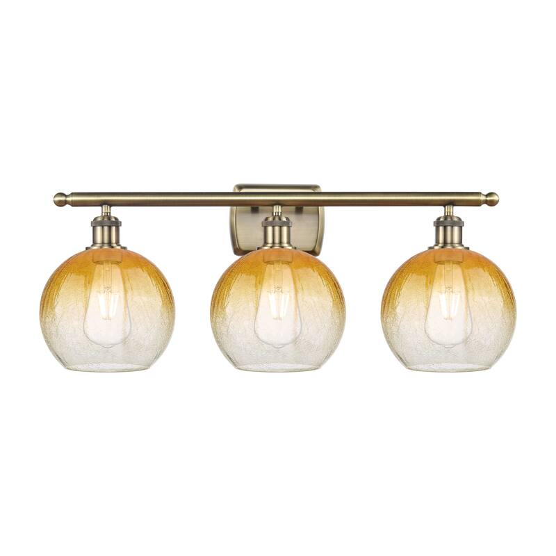 Innovations Lighting Endless Possibilities Ballston - Brookhaven Globe - 3 Light 28" Bath Vanity Light - Antique Brass/Amber