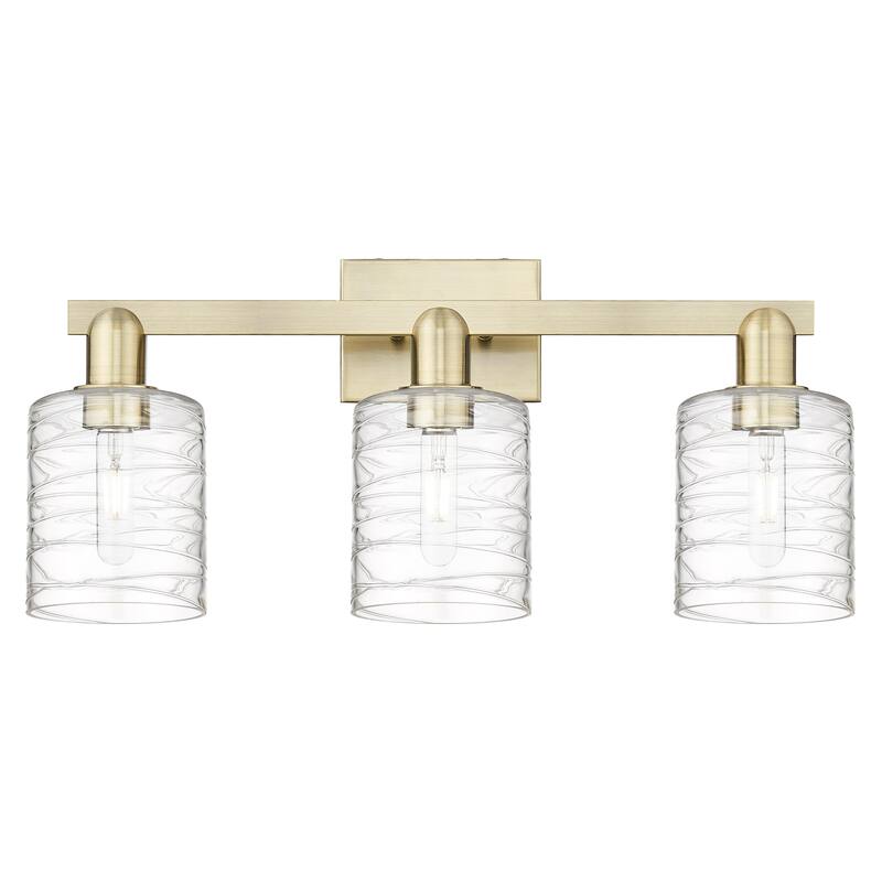 Innovations Lighting Endless Possibilities Arcadia - Cobbleskill - 3 Light 24" Bath Vanity Light - Antique Brass/Deco Swirl
