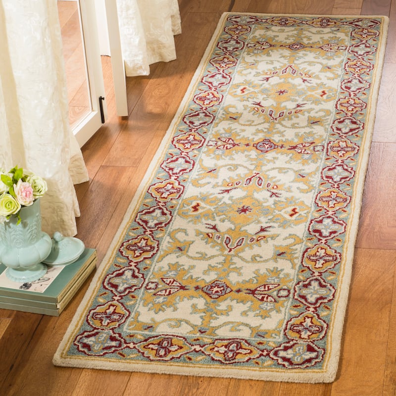 SAFAVIEH Handmade Heritage Wildfire Traditional Oriental Wool Rug - 2'3" x 8' Runner - Ivory/Blue