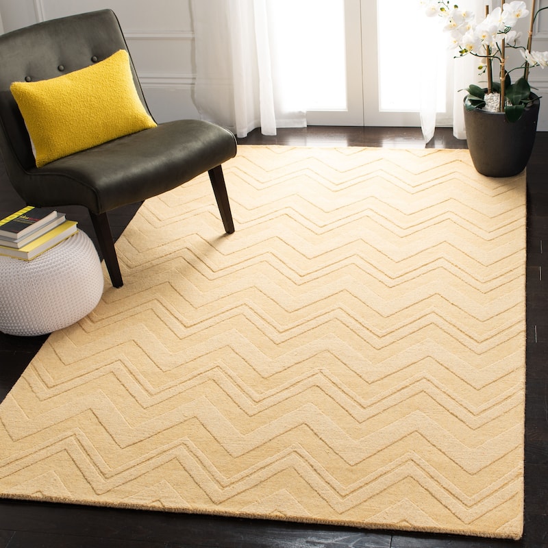 SAFAVIEH Handmade Impressions Frouwe Modern Wool Rug - 7'6" x 9'6" - Gold