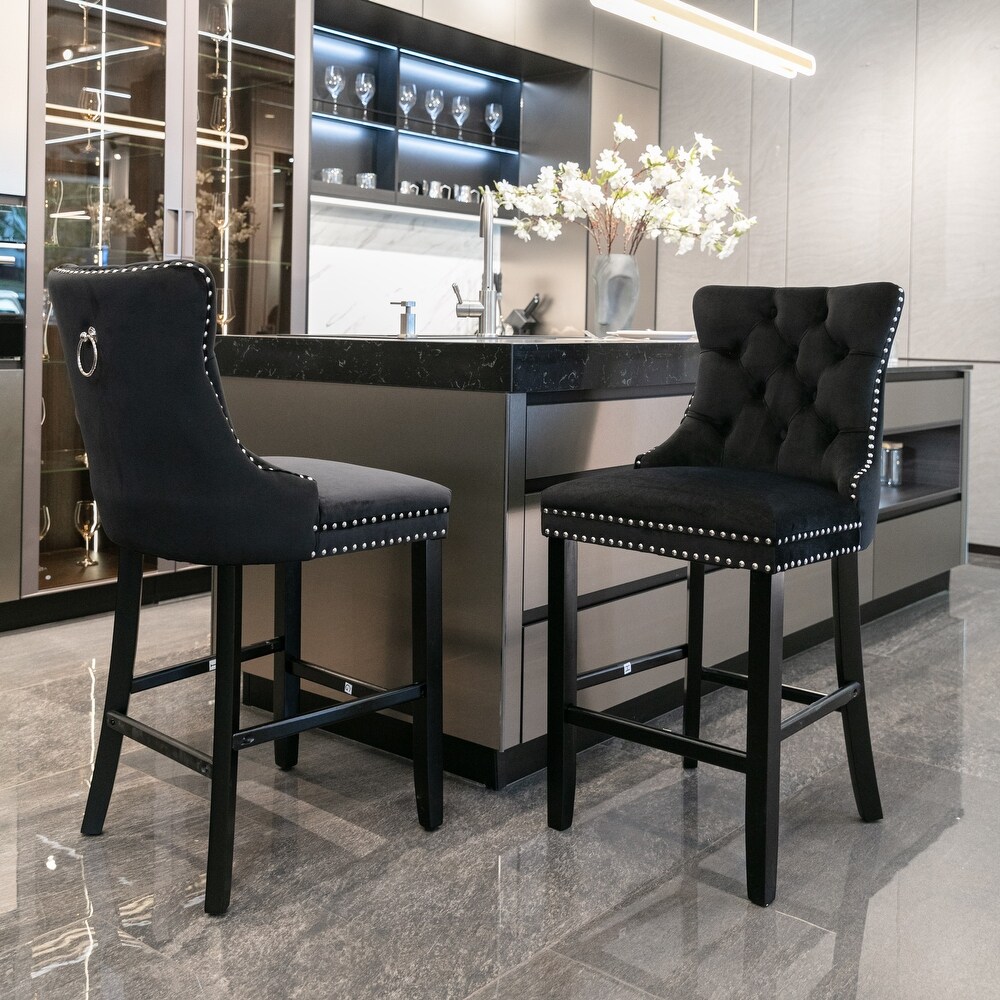 Black tufted store bar stools