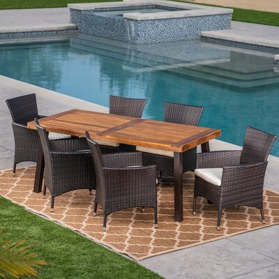 Tustin 7 piece outdoor wicker dining set on brown area rug on sale at Overstock