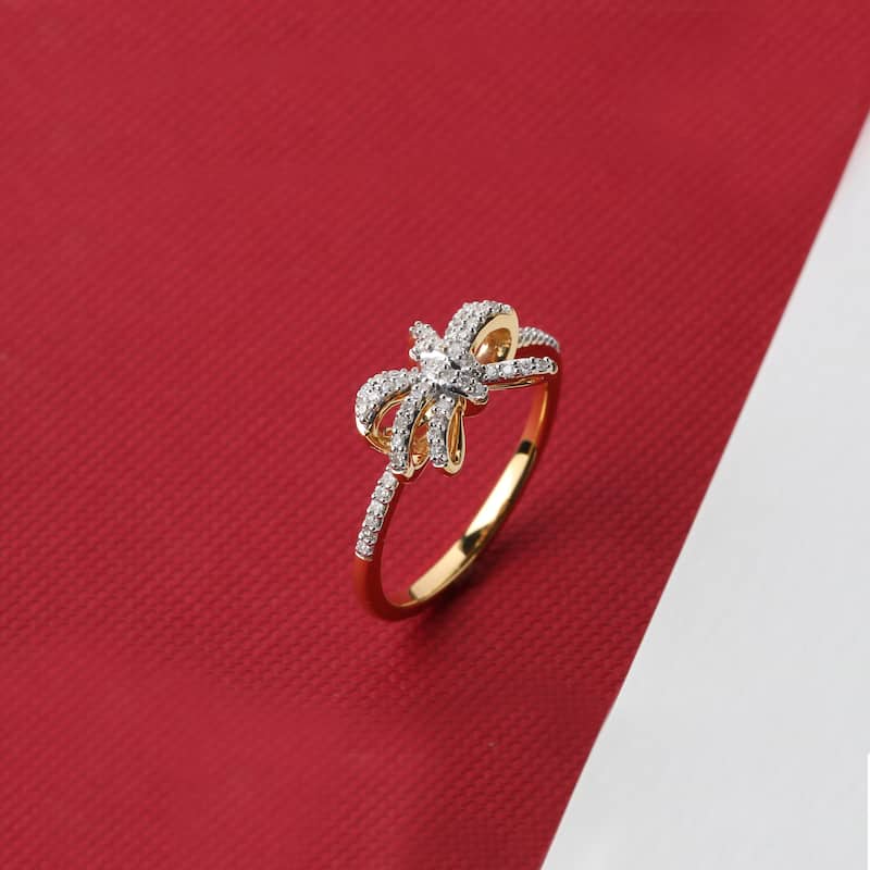 1/6ct TDW Diamond Knot Bow Fashion Ring in 10K Gold for Women
