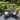 5-Piece Patio Dining Set , 4 Rattan Wicker C Spring Rocking Chair with Cushion, and 1 Round Metal Table with 1.9'' Umbrella Hole