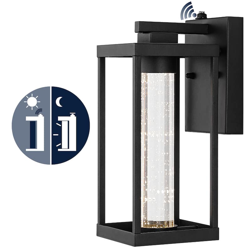 Justina 4.75" 1-Light Industrial Iron/Seeded Glass with Dusk-to-Dawn Sensor Integrated LED Outdoor Sconce, Black by JONATHAN Y - Black