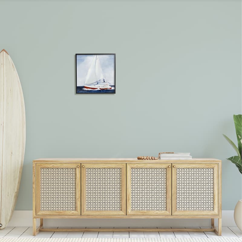 Stupell Sail Boat Against Cloudy Sky Ocean Foam Splashing Framed Wall Art - Blue