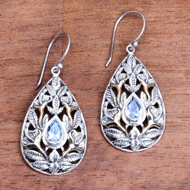 NOVICA Hidden Jungle, Gold accented blue topaz dangle earrings - 1.8*0.8