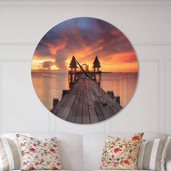 slide 2 of 10, Designart 'Glowing Sky and Long Wooden Bridge' Oversized Coastal Wall CLock