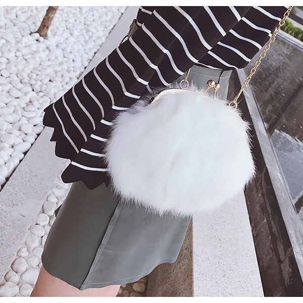 white fluffy clutch bag