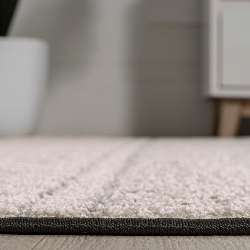 JONATHAN Y Duenas High-Low Two-Tone Monstera Leaf Area Rug