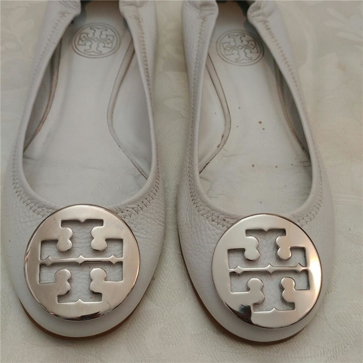 tory burch black flats with silver logo